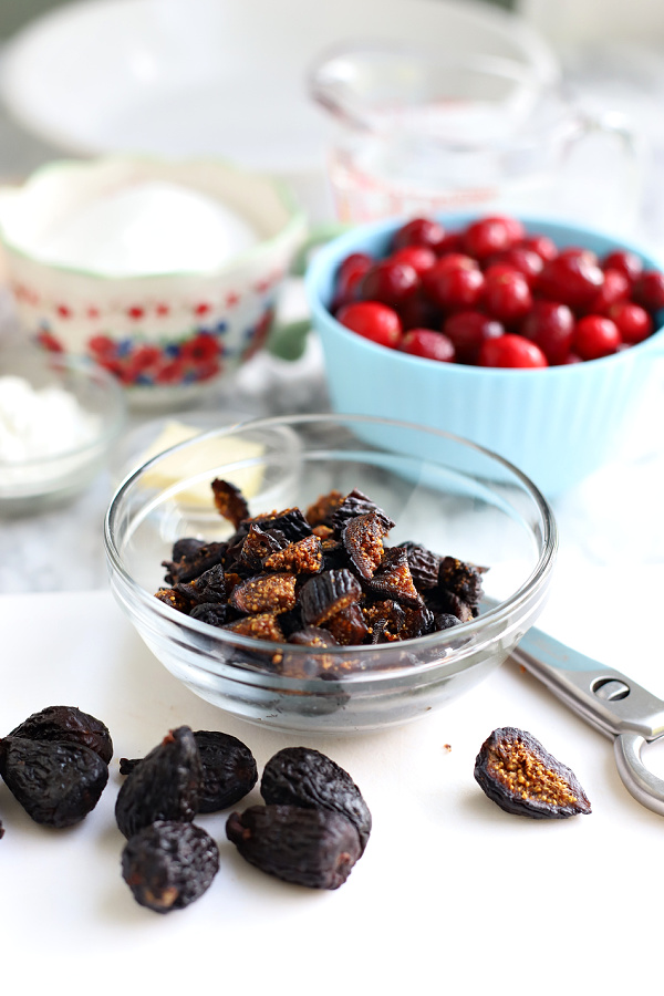 cutting dried figs for cranberry and fig pie