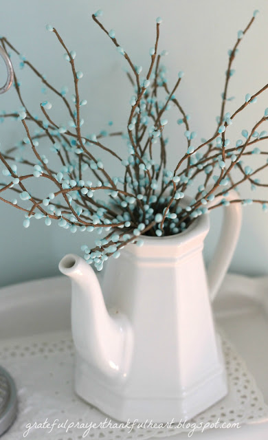 Easy DIY Powder Room redo in Aqua frost paint color with pretty white accents found around the house and re-purposed to create a lovely room on a budget.