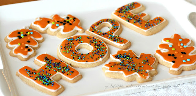 Frosted Sugar Cookies are festive and fun for holidays or birthdays. Easy recipe for cookies and frosting to make the prettiest and tastiest cookies!