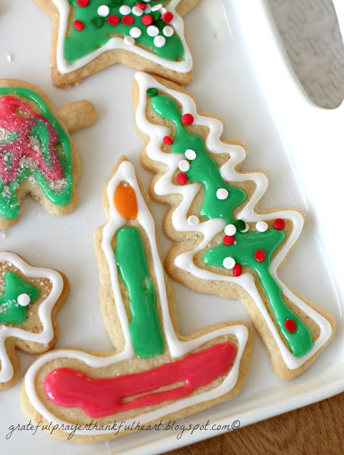 Frosted Sugar Cookies are festive and fun for holidays or birthdays. Easy recipe for cookies and frosting to make the prettiest and tastiest cookies!