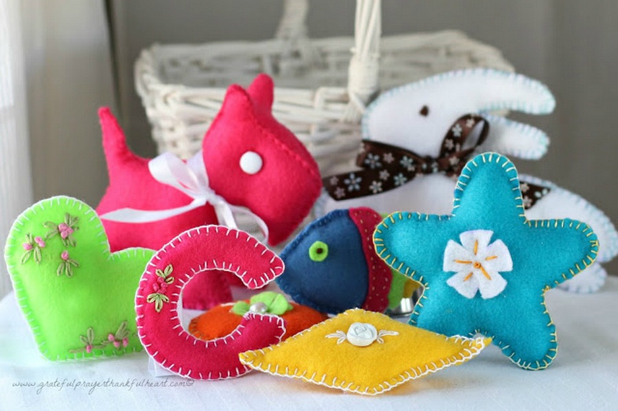 Sweet basket of felt toys for baby's birthday are perfect for little hands. Soft and colorful, in easy-to-make pattern shapes with pretty stitching.