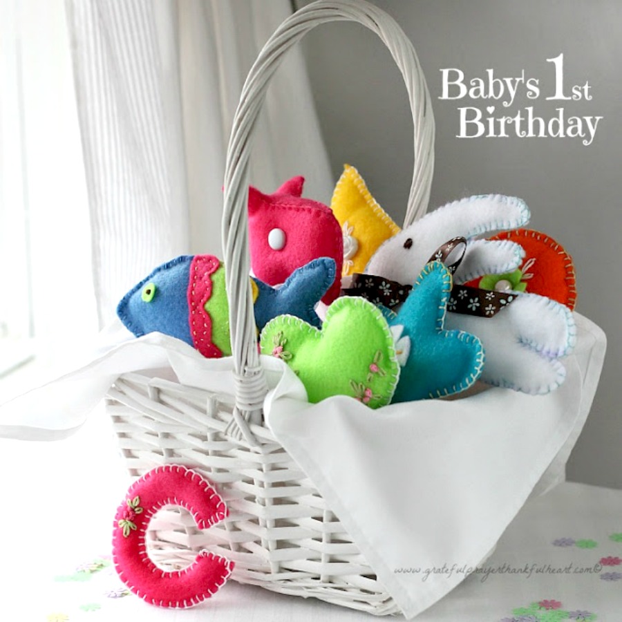 Sweet basket of felt toys for baby's birthday are perfect for little hands. Soft and colorful, in easy-to-make pattern shapes with pretty stitching.