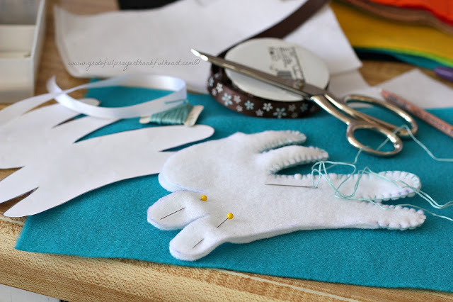 Sweet basket of felt toys for baby's birthday are perfect for little hands. Soft and colorful, in easy-to-make pattern shapes with pretty stitching.