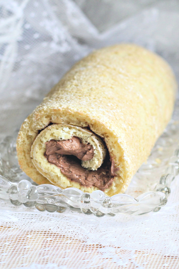 Double Chocolate Irish Cream Cake Roll filled with a creamy chocolate center and covered with a decadent chocolate ganache for St Patrick's Day.