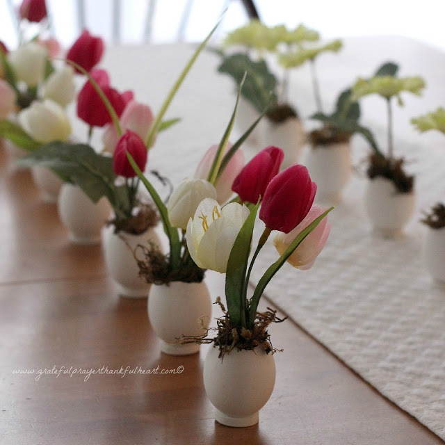 Sweet and dainty, springtime Easter flowers in eggshell pots are super cute. Fill with faux flowers, fresh cut flowers or plant seeds and watch them sprout. Tuck into spaces needing some happy after a dreary winterscape.