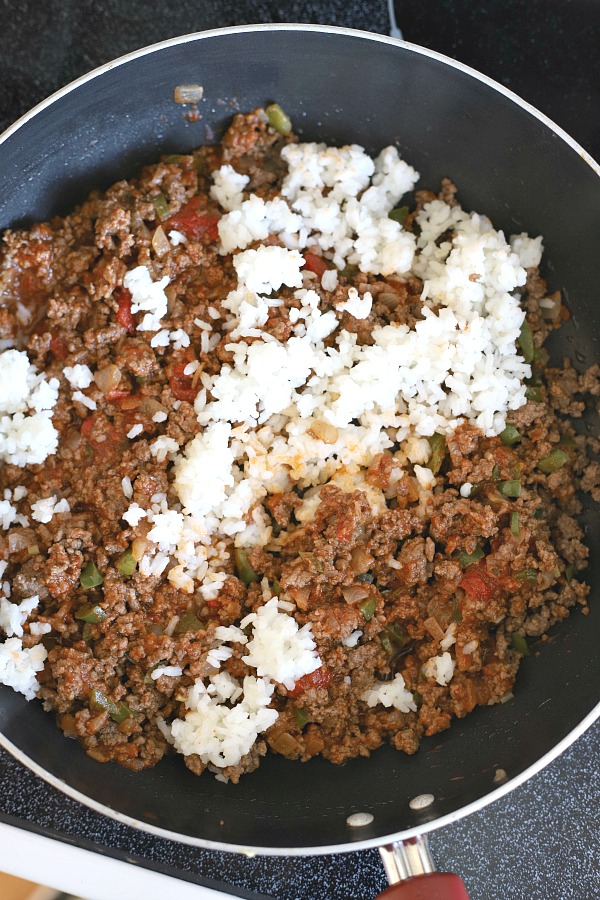 Classic stuffed peppers are an easy and comforting meal of tender bell peppers filled with ground beef and rice, baked and topped with your favorite sauce. 