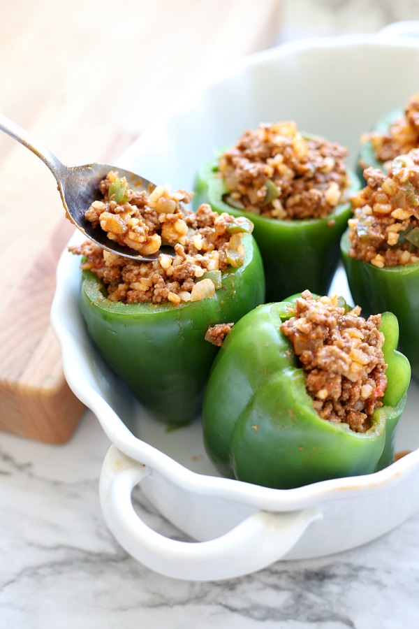 Classic stuffed peppers are an easy and comforting meal of tender bell peppers filled with ground beef and rice, baked and topped with your favorite sauce. 