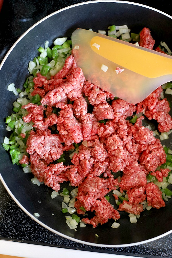 Classic stuffed peppers are an easy and comforting meal of tender bell peppers filled with ground beef and rice, baked and topped with your favorite sauce. 