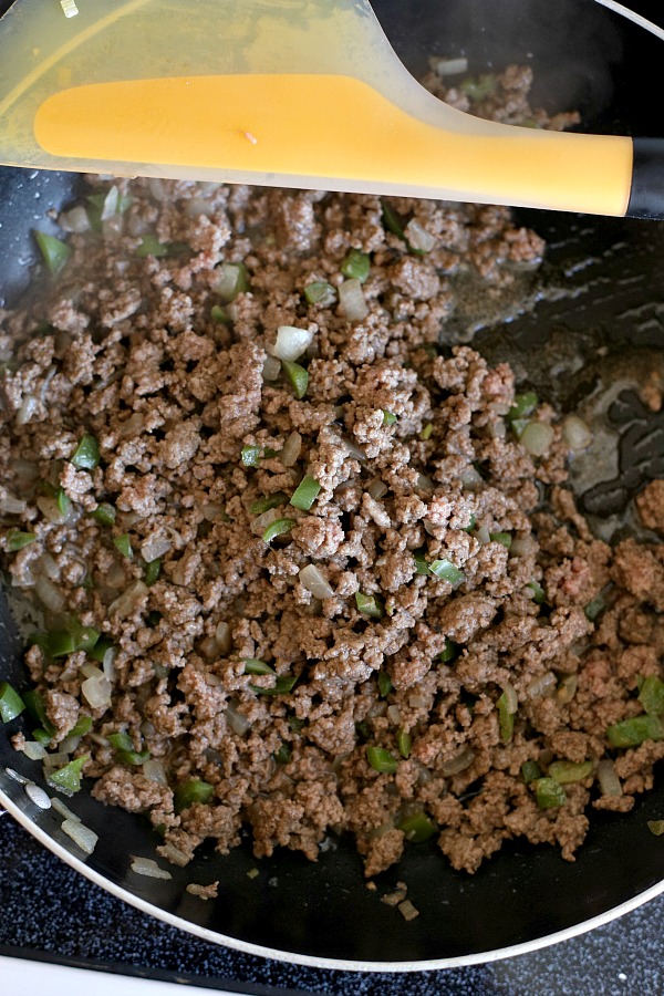 Classic stuffed peppers are an easy and comforting meal of tender bell peppers filled with ground beef and rice, baked and topped with your favorite sauce. 