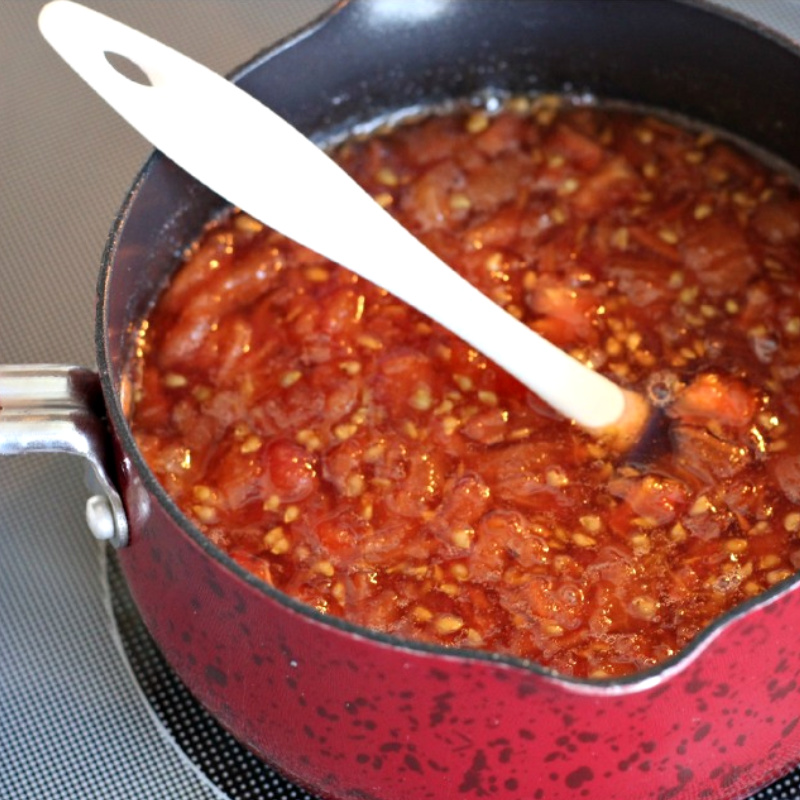 Make a delicious tomato jam using just garden fresh tomatoes, sugar and lemon or line juice. Grandmom Gaskill's Tomato Jam is an easy, vintage recipe handed generations for canning, spreading on crackers as an appetizer or spreading on toast or biscuits. 