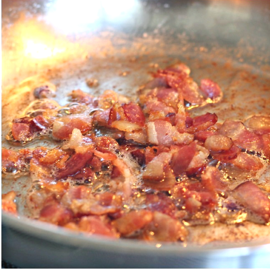 Easy recipe for bacon tomato jam, of sauteed bacon and sweet onions. A savory condiment with a little kick perfect for burgers, eggs and veggies.