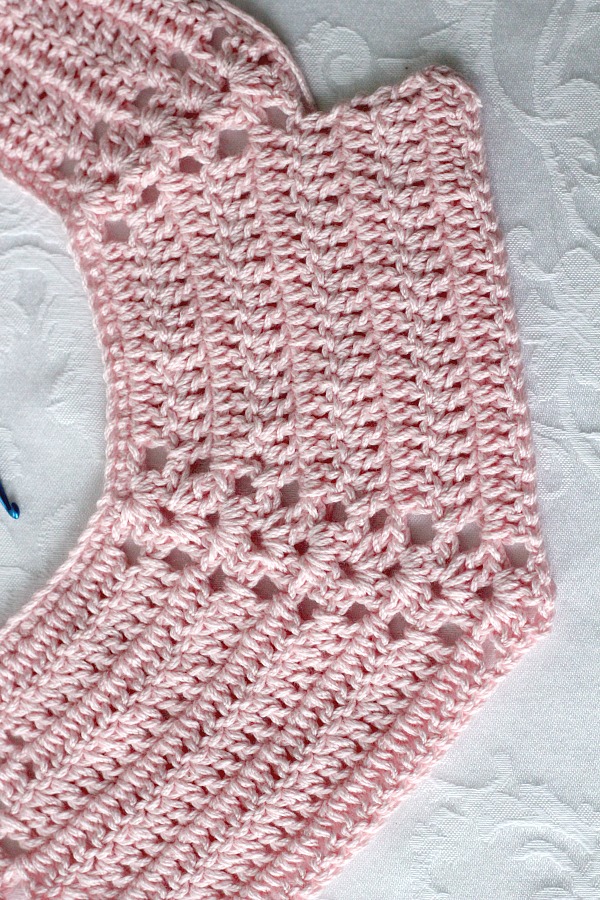 Sweet crochet baby bib is adapted from a vintage pattern and perfect for a toddler. Almost too pretty to use as a bib but adorable to dress up an outfit.