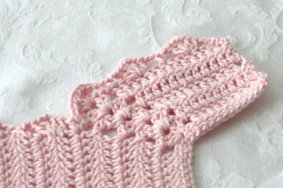 Sweet crochet baby bib is adapted from a vintage pattern and perfect for a toddler. Almost too pretty to use as a bib but adorable to dress up an outfit.