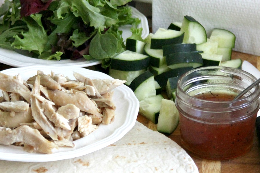 Easy, delicious & healthy lunchtime or lighter evening meal. Chicken Wrap with crisp cucumber, chicken, spring greens rolled up in a tortillas & drizzled with sweetened chili sauce is a perfect choice.