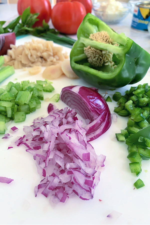 chopped onion, celery, peppers and water chestnuts for creamy chicken stuffed tomatoes