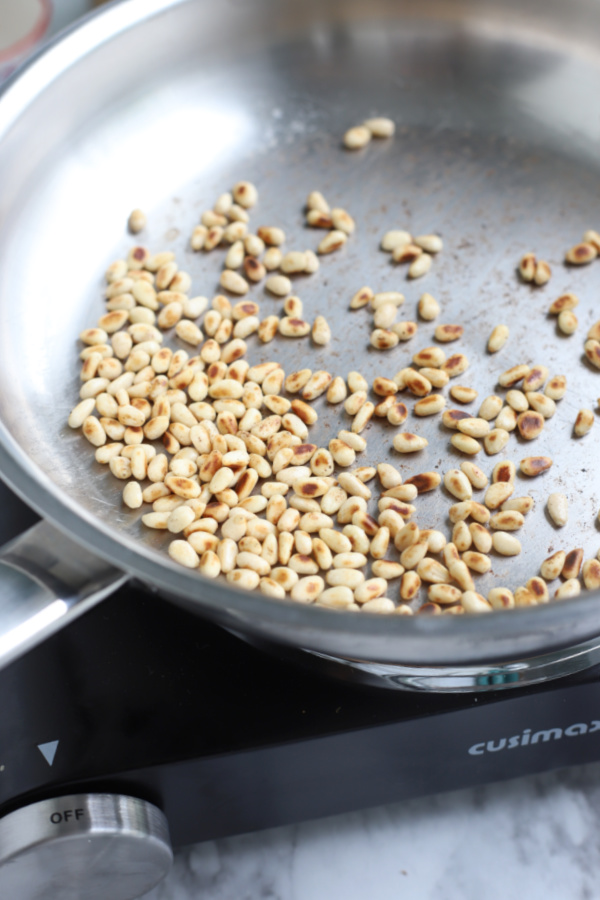 Toasting pine nuts for fresh basil pesto