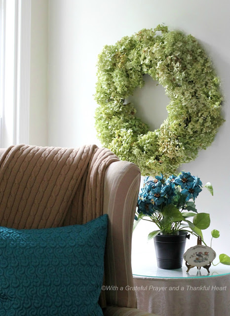 Preserve hydrangea, roses and garden flowers by drying then used to create a lovely wreath.