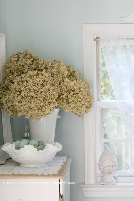 Preserve hydrangea, roses and garden flowers by drying then used to create a lovely wreath.