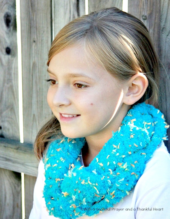 Easy pattern for crochet infinity braided scarf. Three strips worked in basic crochet stitches, braided and stitched together. Very adaptable pattern.