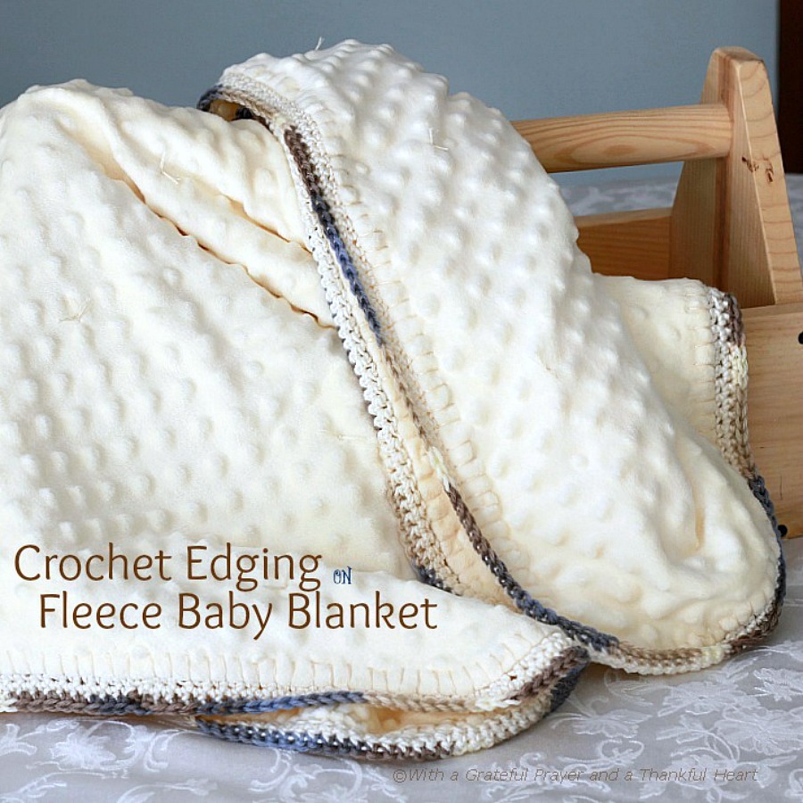 Crochet edge baby blanket with a sweet border around a fleece fabric creating a cozy, snuggly lovey. Perfect baby shower gift or as a sofa throw.