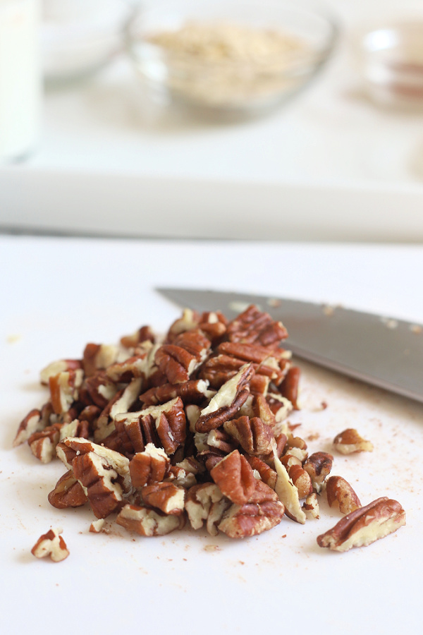 chopping pecans to make apple coffee cake recipe