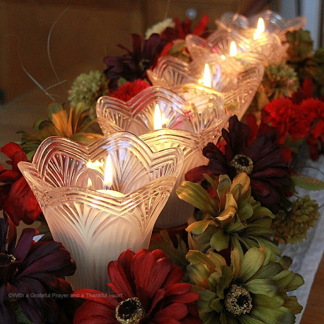 Don't trash those globes from the chandelier you just replaced. Recycle and repurpose globes to make a candlelight arrangement for Thanksgiving or any season or holiday.