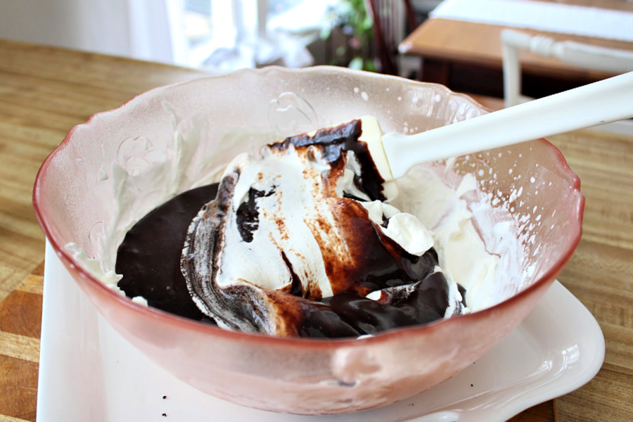 Easy recipe for frozen minty mousse pie with a layers of ice cream, chocolate mousse and whipped cream in a cookie crust is just right for St Patrick's Day