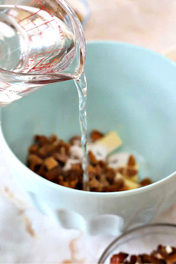 Macerating the dried fruit for fig & date nut quick bread recipe.