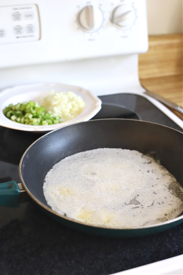 Preparing to simmer celery and onions in butter