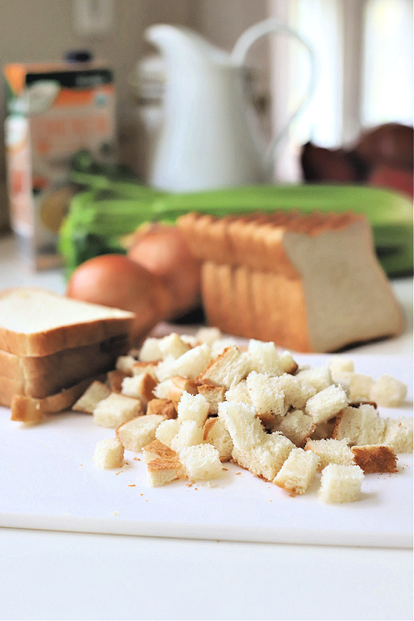 Cutting bread into cubes for Thanksgiving Old Time Stuffing