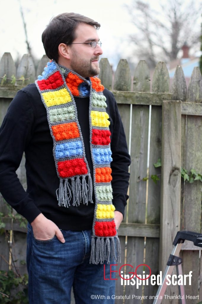 Easy pattern for a Crochet Lego Blocks Scarf for the hipster or kid on your gift-giving list. Colorful popcorn stitch creates Lego looking blocks.