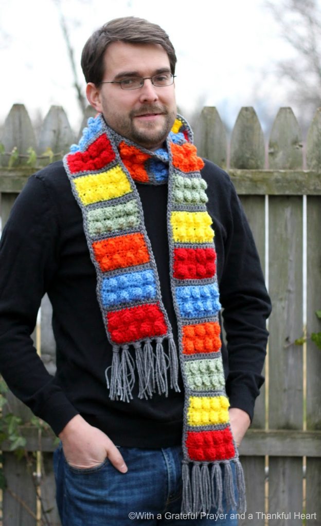 Easy pattern for a Crochet Lego Blocks Scarf for the hipster or kid on your gift-giving list. Colorful popcorn stitch creates Lego looking blocks.