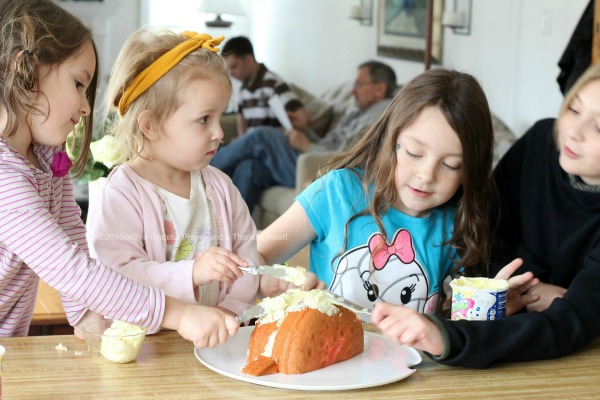 This adorable Easter bunny cake is made using a box cake and frosting (either homemade or from a tub). Our girls had the best time assembling it and were overjoyed with their finished creation. Truly a fun project and a lovely Easter dessert. It looks super cute on the holiday table.