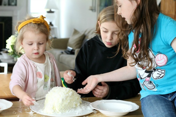 This adorable Easter bunny cake is made using a box cake and frosting (either homemade or from a tub). Our girls had the best time assembling it and were overjoyed with their finished creation. Truly a fun project and a lovely Easter dessert. It looks super cute on the holiday table.