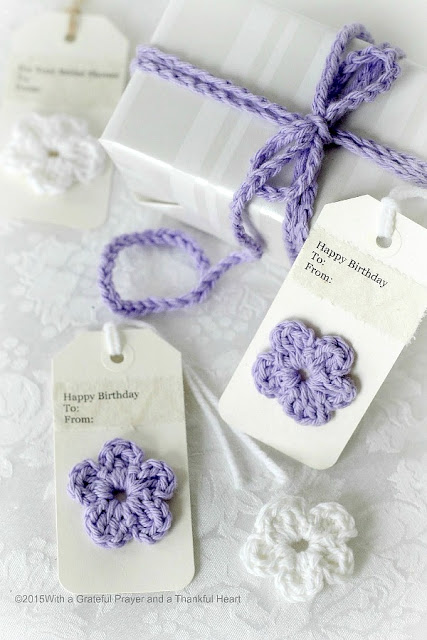 Embellish gift packages with quick and easy crochet gift tags, ties & bows. Reusable and so cute. Add tiny flowers, hearts, leaves and wreaths of yarn. 