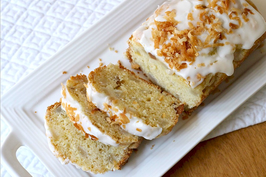 Frosted Pear Quick Bread with Toasted Coconut is a yummy quick bread filled with fresh pears, a hint of ginger and topped with frosting and toasted coconut.