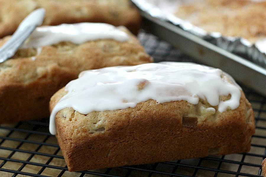 Frosted Pear Quick Bread with Toasted Coconut is a yummy quick bread filled with fresh pears, a hint of ginger and topped with frosting and toasted coconut.