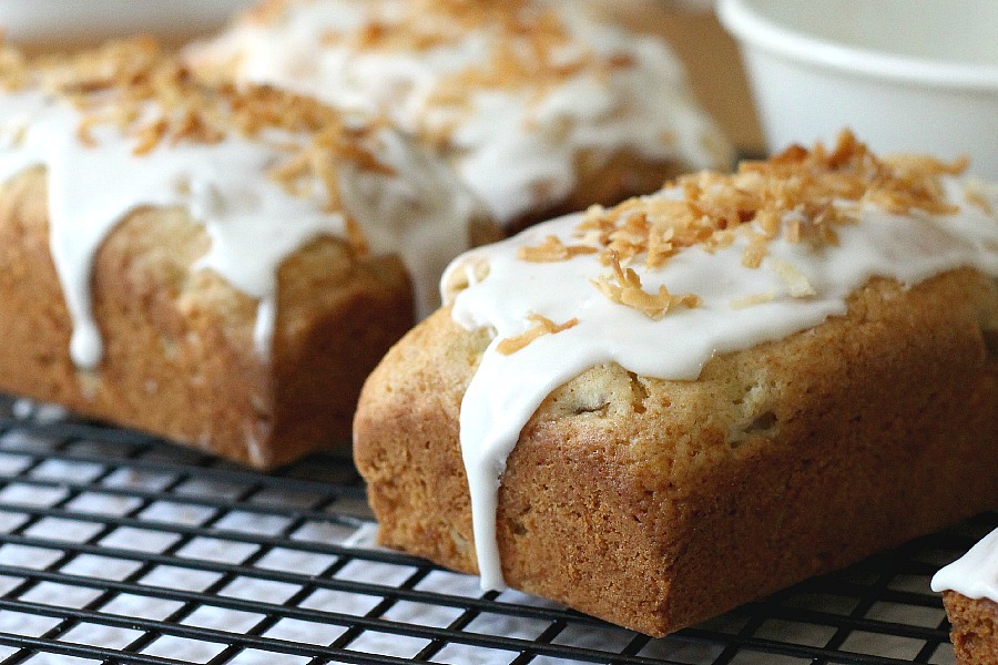 Frosted Pear Quick Bread with Toasted Coconut is a yummy quick bread filled with fresh pears, a hint of ginger and topped with frosting and toasted coconut.