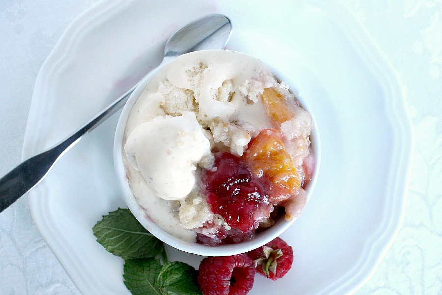 Make an easy Peach & Raspberry Crisp using fresh summer peaches and plump raspberries with a lovely crumb topping. Serve with a scoop of vanilla ice cream.