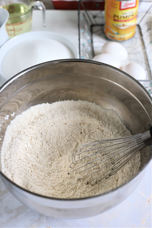 whisking together dry ingredients for pumpkin bread