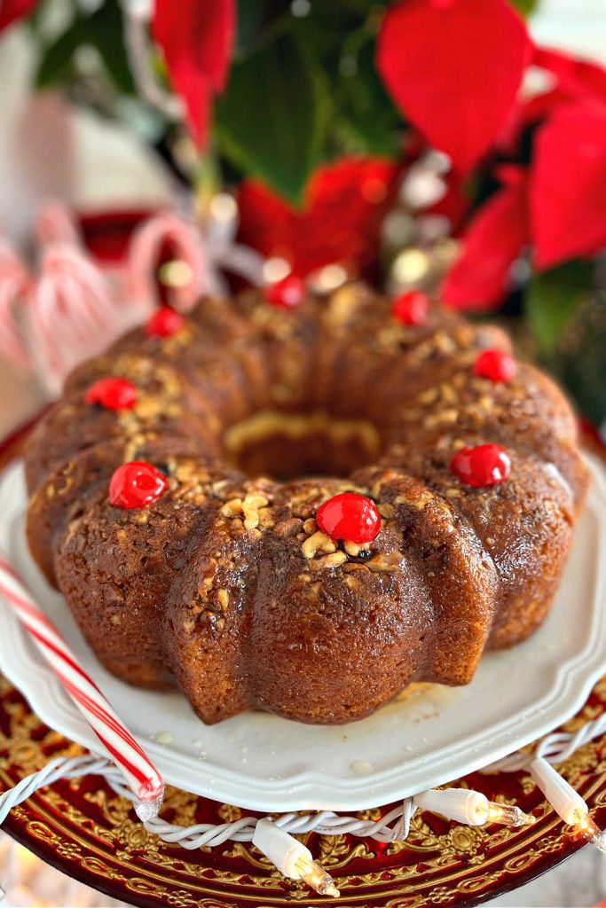 Festive butter rum glazed rum cake is a quick and easy recipe because it begins with a box mix! Perfect Christmas & holiday dessert or gift!