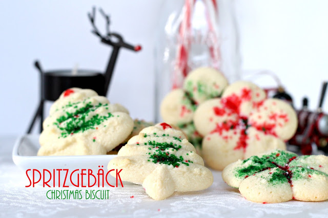 Spritz or Spritzgebäck cookies, are festive and buttery, made using a cookie press then decorated with colorful sugars. Easy to make Christmas favorite.