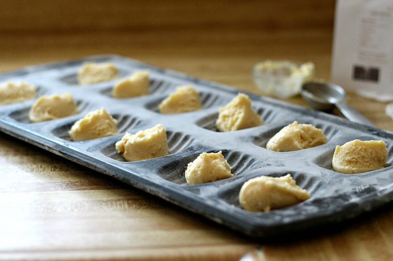 Madeleines are small sponge cakes with a distinctive shell-like shape.  These little cakes are browned and crispy on the outside and spongy and soft on the inside. Lemon Glazed French Madeleines are a perfect accompaniment to your afternoon cup of tea.