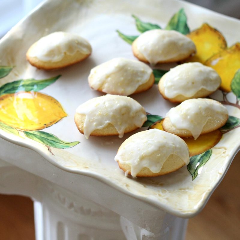 Madeleines are small sponge cakes with a distinctive shell-like shape.  These little cakes are browned and crispy on the outside and spongy and soft on the inside. Lemon Glazed French Madeleines are a perfect accompaniment to your afternoon cup of tea.