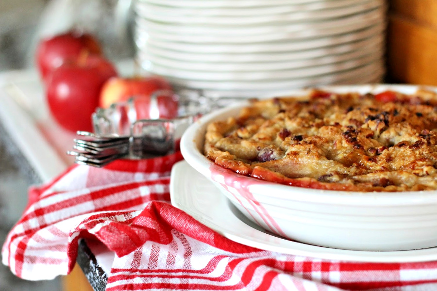 Easy recipe for cranberry apple pie with pecan streusel is an exciting combination of sweet and tart with a crunchy topping that's especially delicious served with a scoop of vanilla ice cream!