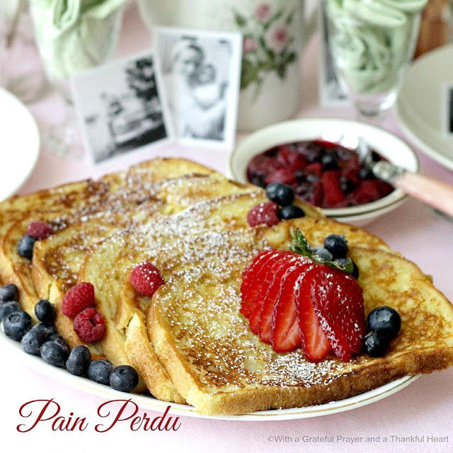 Thick slices of French Toast dusted with confectioners' sugar and served with maple syrup and fruit. It is like eating dessert for breakfast!