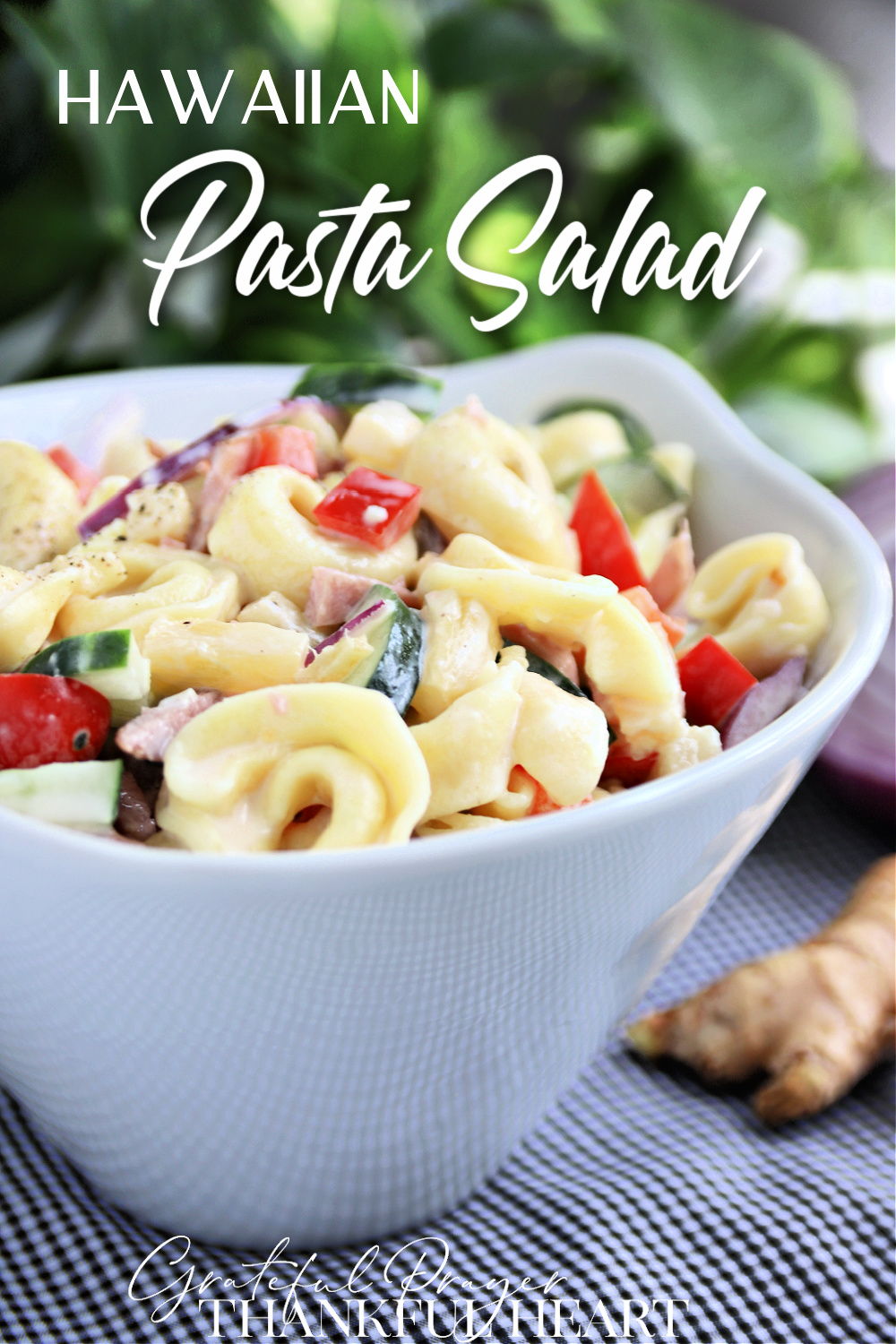 Hawaiian Pasta Salad with brightly colored veggies is a perfect summer salad. It is a hearty one too, with cheese tortellini, diced ham, bell peppers, cherry tomatoes and pineapple in a creamy dressing.