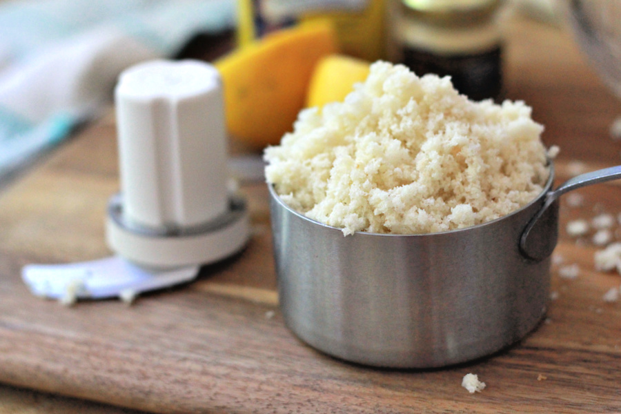 Using a food processor to prepare breadcrumbs for classic crab cakes recipe.