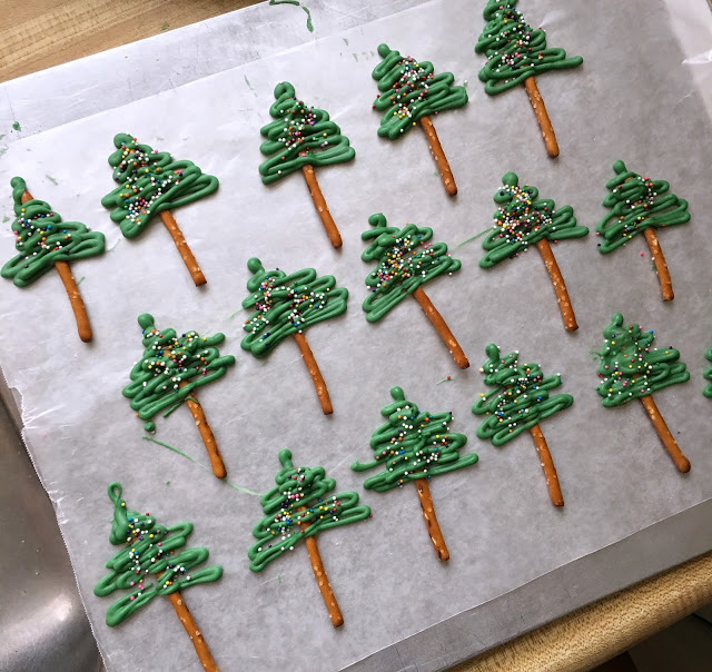 Easy to make, Chocolate Pretzel Christmas Tree Cupcake Toppers look so festive atop coconut frosted cupcakes. A yummy and decorative Christmas treat.