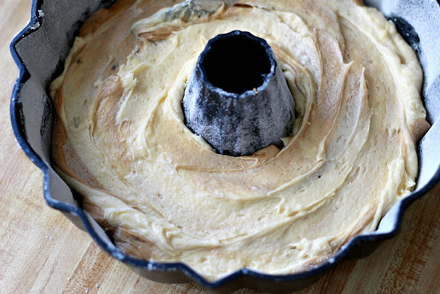 How to make an easy Coffee Marbled Bundt Cake with Dark Chocolate Ganache. Great birthday or any occasion dessert. Swirls of yellow cake and coffee flavored cake with a decadent dark chocolate ganache drizzled on top.